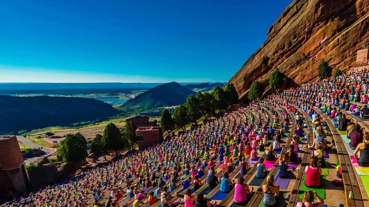 Yoga practitioners at Red Rocks Amphitheatre in Colorado, USA 