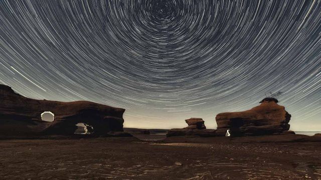 A Martian-esque landscape of sandstone arches in Nova Scotia's Minas Basin at low tide