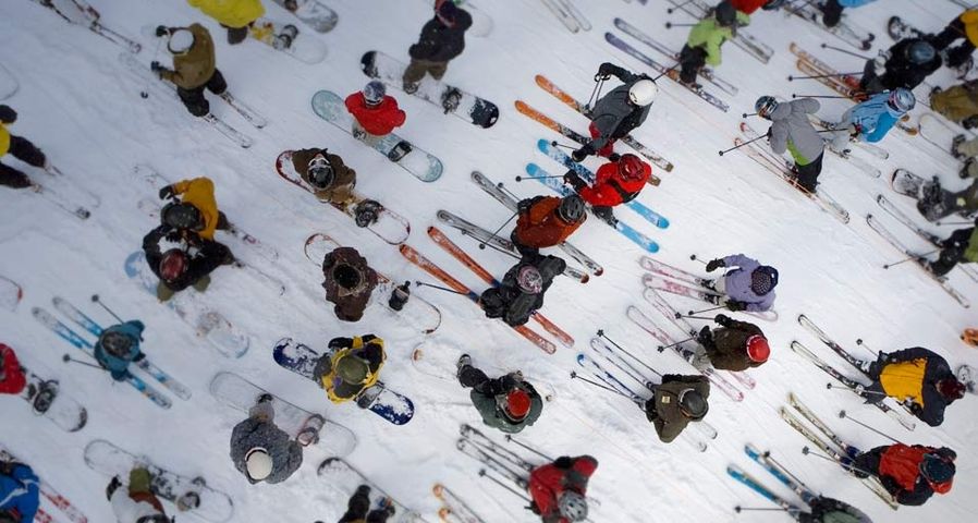 Skiers and snowboarders in lift line on Mt. Hood, OR
