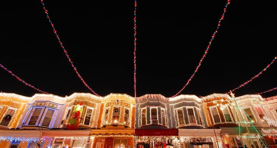 Christmas lights adorn the row houses on 34th Street in the Hampden neighborhood of Baltimore, Maryland, USA