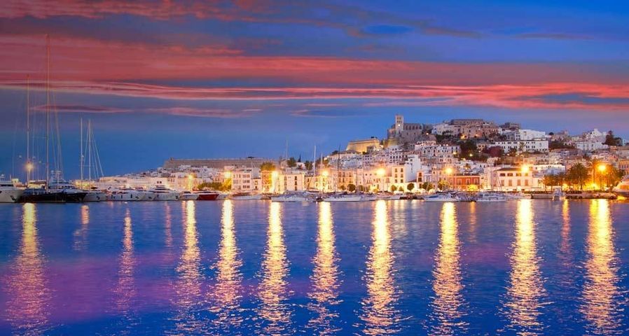 Ibiza island night view of Eivissa town and sea lights reflection