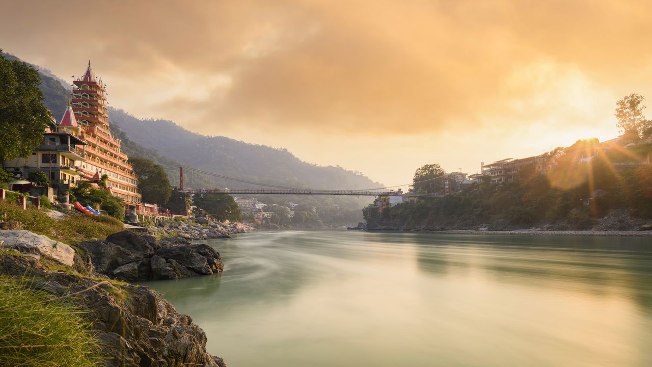 Ganga river, Lakshman Jhula, and Tera Manzil Temple in Rishikesh, India