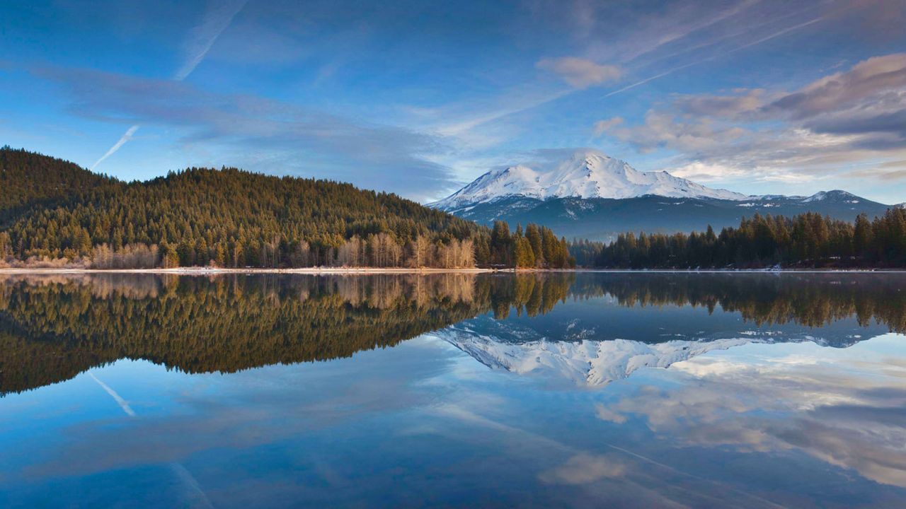 Lake Siskiyou reflects snowy Mount Shasta in northern California 