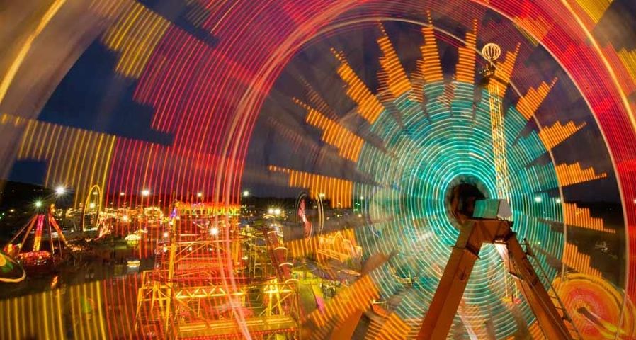 Spinning carnival rides at the Kansas State Fair in Hutchinson, Kansas