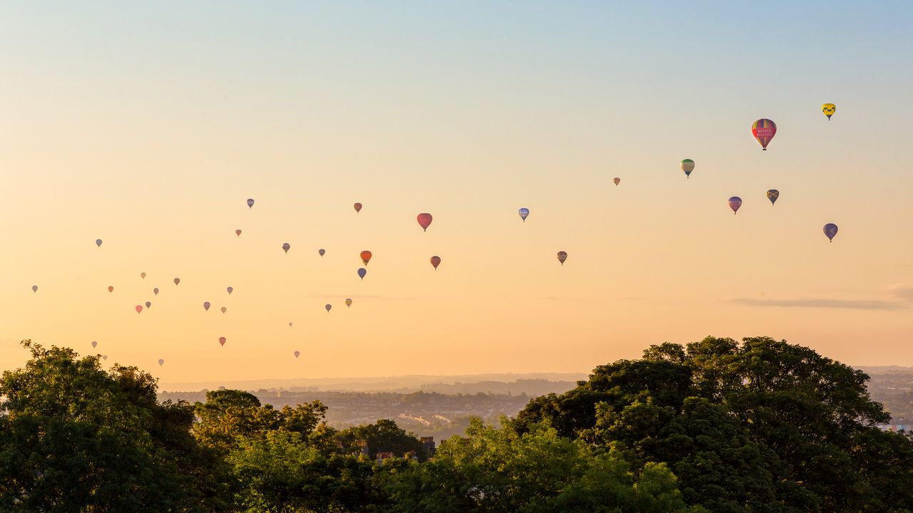 Hot air balloons above Bristol city centre, England