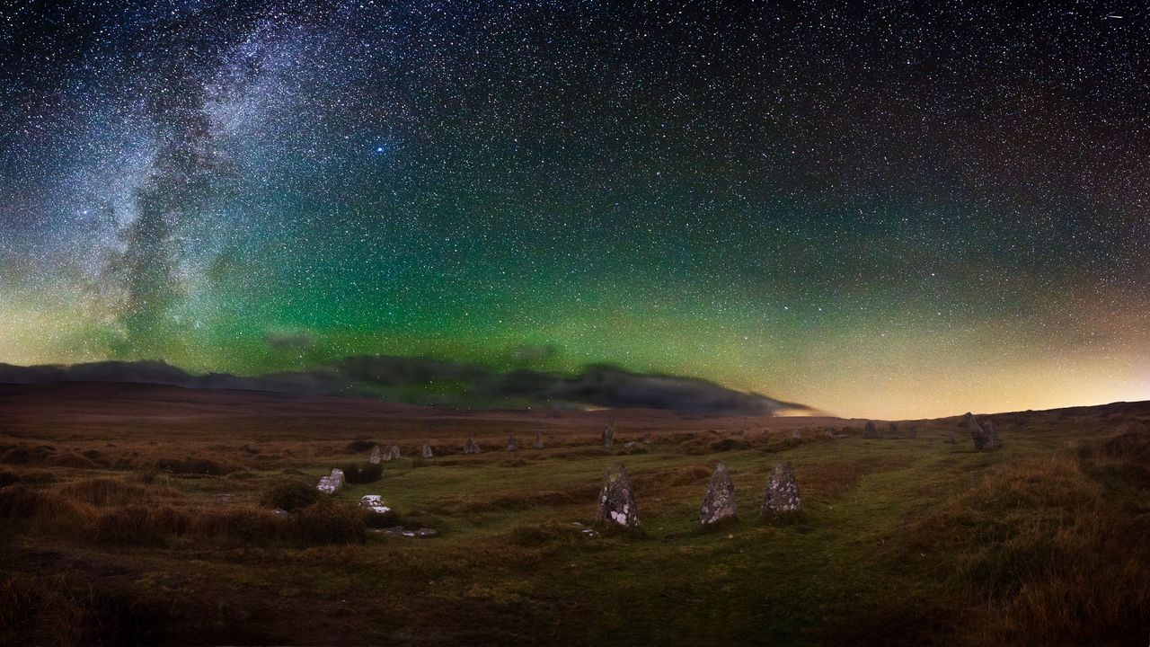 Dartmoor's Scorhill Stone Circle under a starry night sky, Devon.
