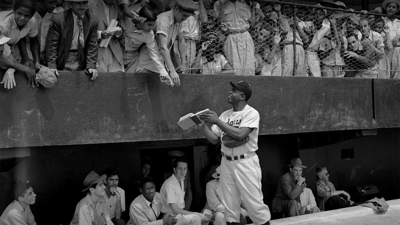 Jackie Robinson signs autographs at spring training in Ciudad Trujillo, now Santo Domingo, Dominican Republic, on March 6, 1948