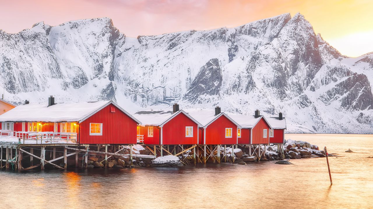 Traditional red fishermen's cabins on the shore of Reinefjorden, Norway
