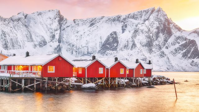 Traditional red fishermen's cabins on the shore of Reinefjorden, Norway