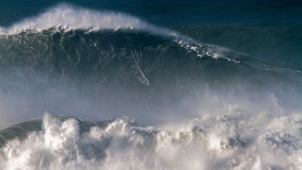 Rodrigo Koxa riding the biggest wave ever surfed, on Nov. 8, 2017, off the coast of Nazaré, Portugal