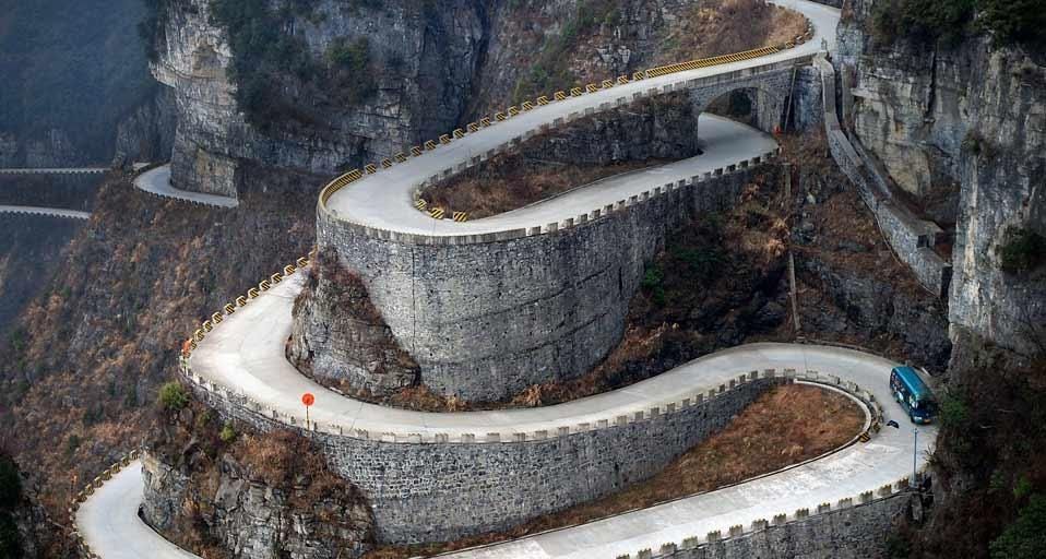 A bus descends the serpentine turns of Tongtian Avenue on Tianmen Mountain near Zhangjiajie, Hunan province, China