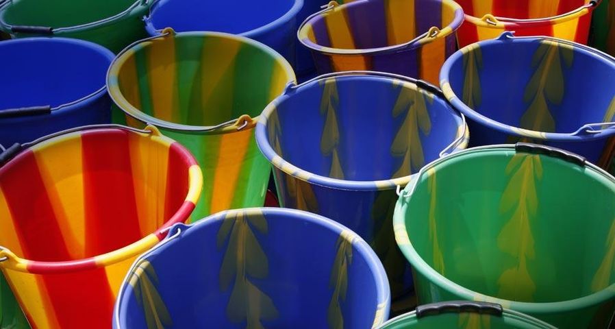 Multicolored buckets at a market in Loropéni, Burkina Faso
