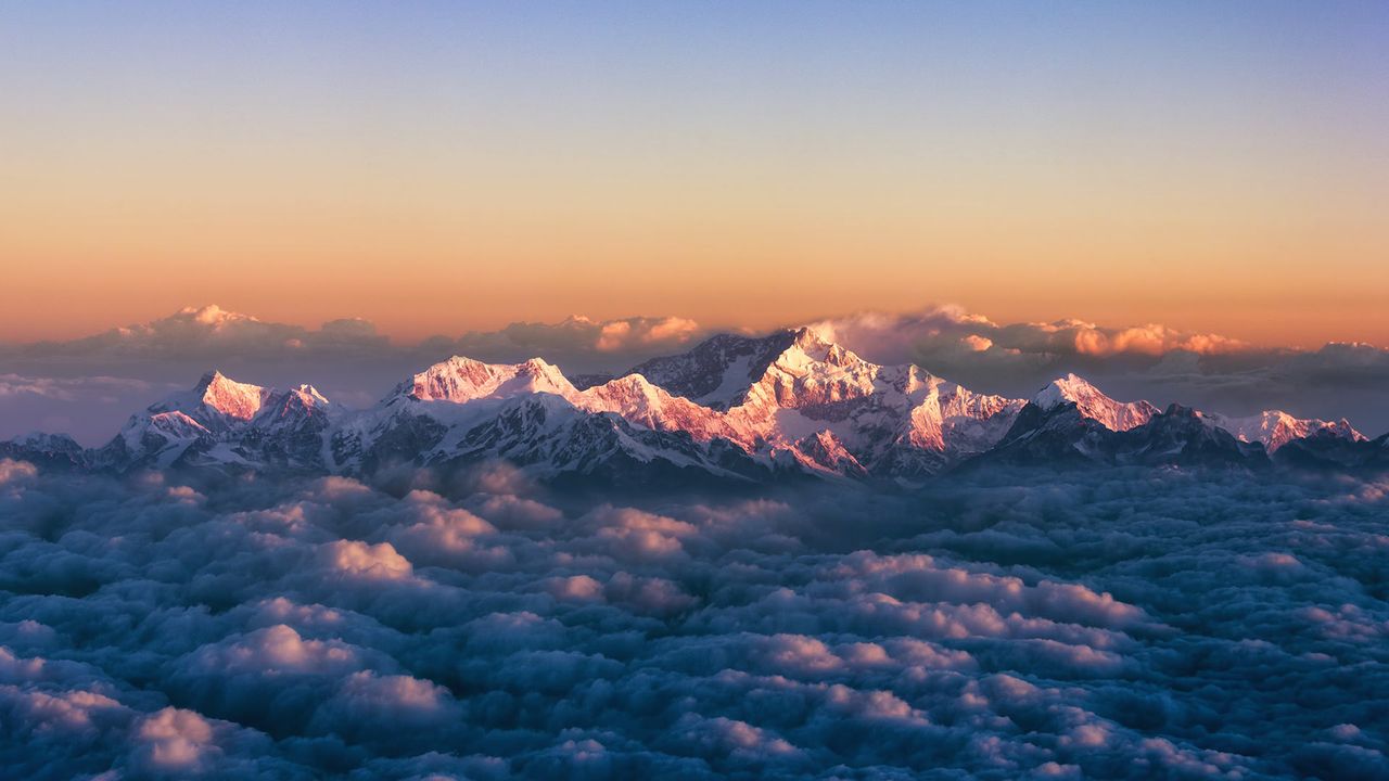 Kanchenjunga, on the India-Nepal border, among a sea of clouds at sunrise