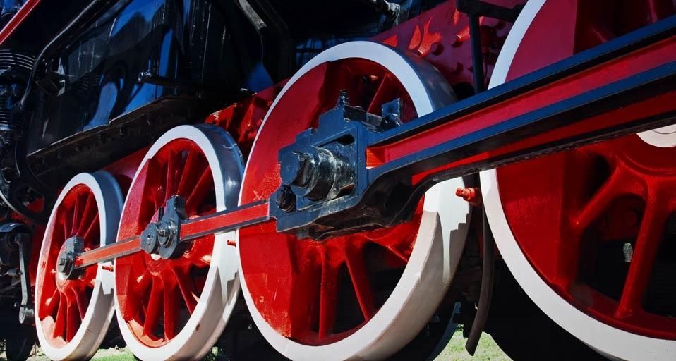 Red wheels of steam train