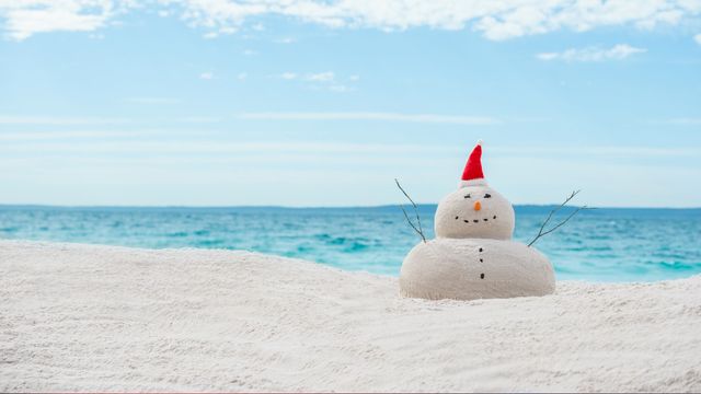 Australian Christmas sandman on a white sand