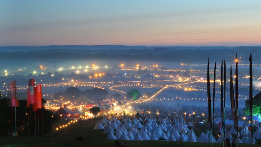 A view of the Glastonbury Festival site from Pennard Hill, Somerset at dawn, June 2009.