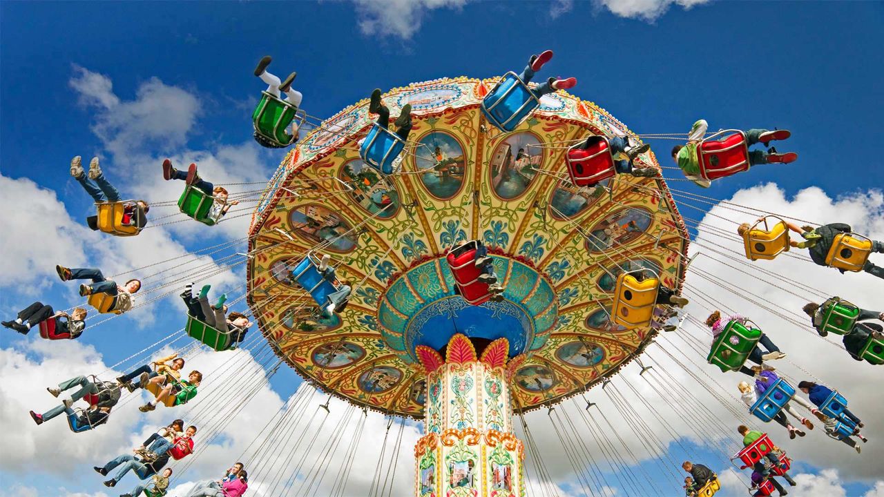 People on a swing ride at a carnival 