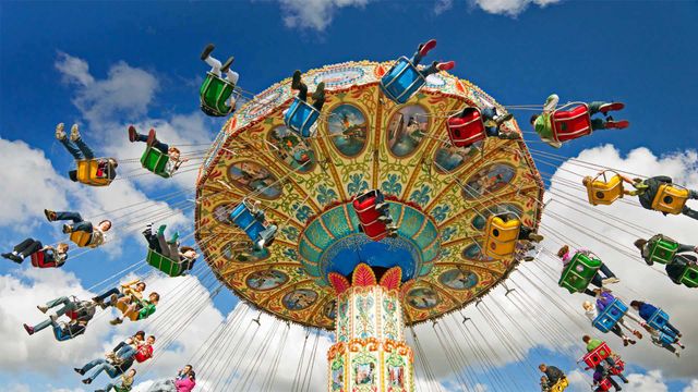 People on a swing ride at a carnival