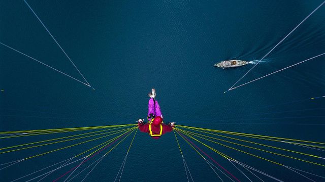 Paraglider over Lake Thun, Switzerland