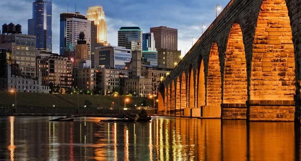 Minneapolis skyline and Stone Arch Bridge over the Mississippi River, Minnesota