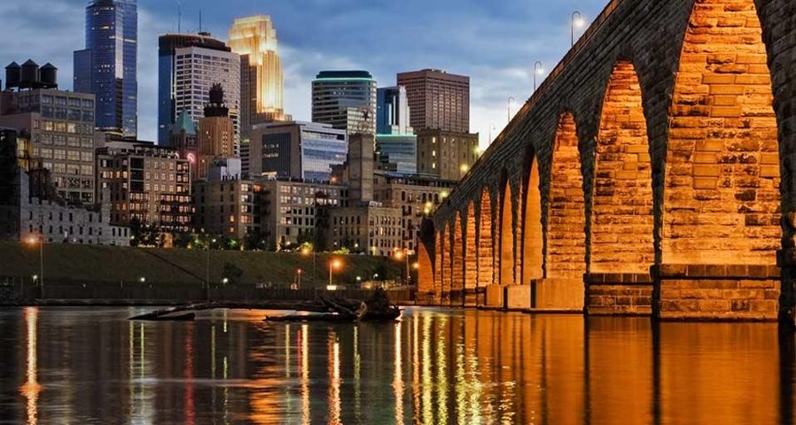 Minneapolis skyline and Stone Arch Bridge over the Mississippi River, Minnesota