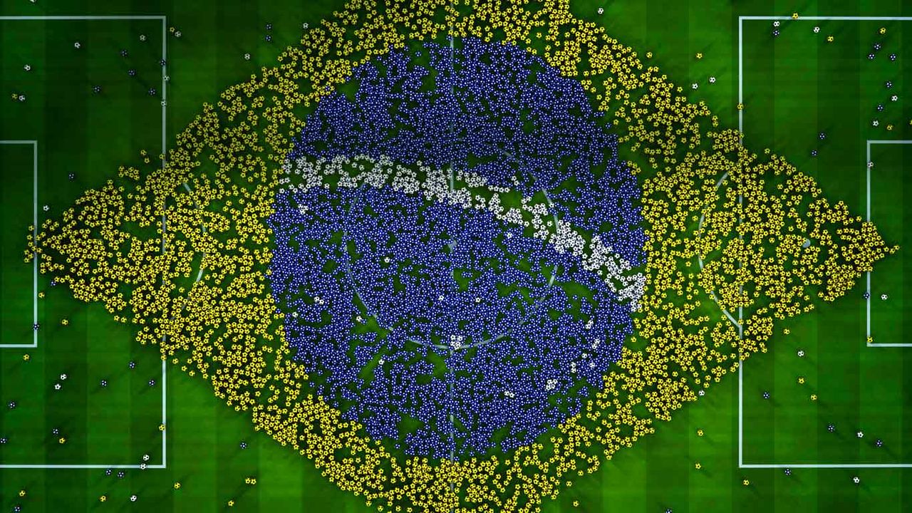 Balls on a soccer field forming a giant flag of Brazil