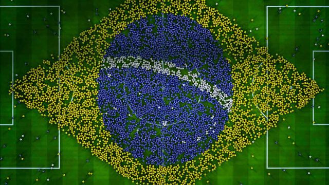 Balls on a soccer field forming a giant flag of Brazil