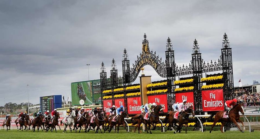 Jockey Damien Oliver riding Warringah leads the field past the post for the first time in the 2009 Emirates Melbourne Cup at Flemington Racecourse on November 3, 2009 in Melbourne, Australia