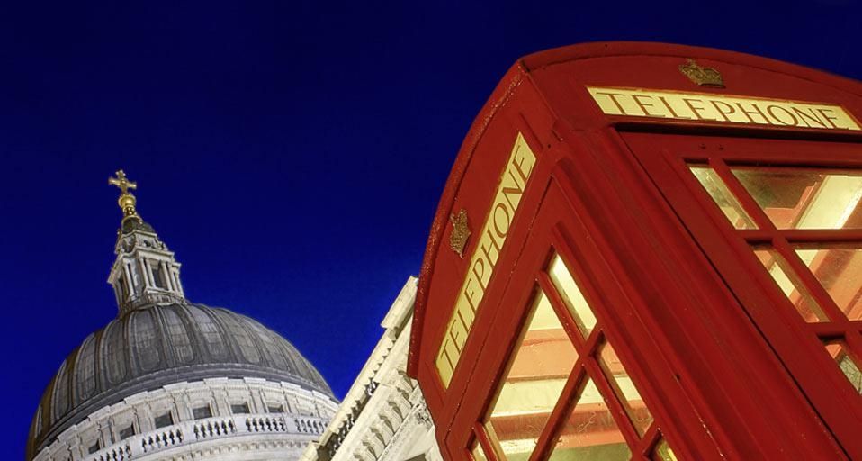 Red telephone booth and St. Paul's Cathedral at dusk, London, England