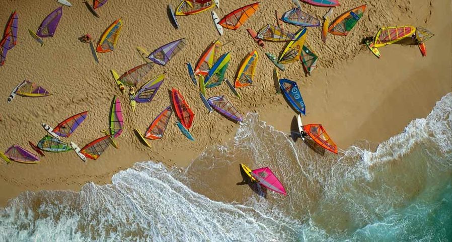 Ho'okipa beach covered with windsurfer boards, Maui, Hawaii