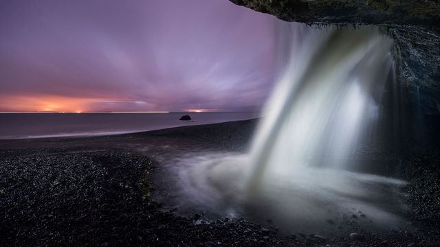 View of a waterfall at Mystic Beach in Juan de Fuca Provincial Park, B.C. during dusk