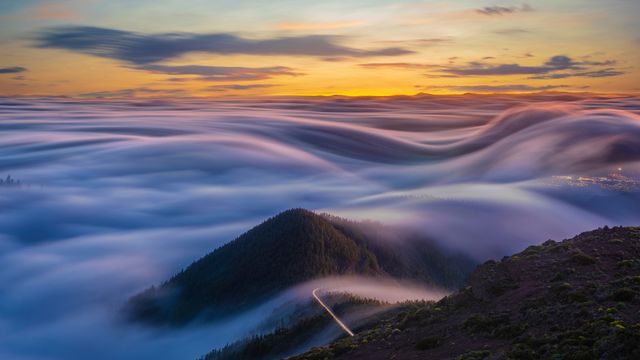 Flowing clouds over the Atlantic Ocean and Tenerife mountains, Canary Islands, Spain