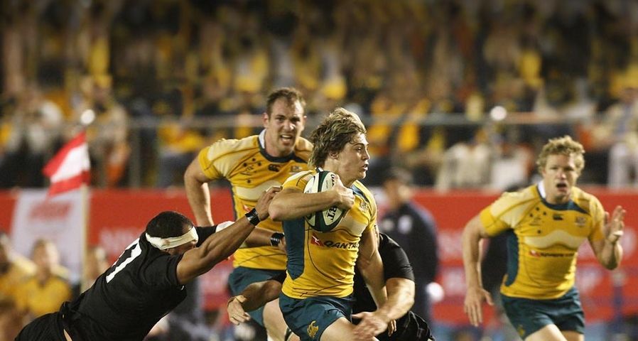 James O'Connor of the Wallabies is tackled during the 2009 Bledisloe Cup match between the New Zealand All Blacks and the Australian Wallabies at the National Stadium in Tokyo, Japan
