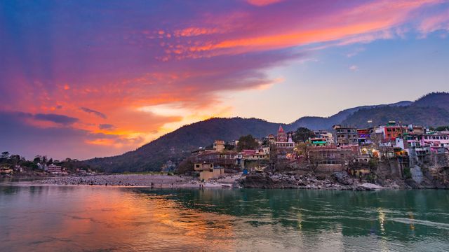 Colourful sky and clouds reflecting over the Ganges River, Rishikesh