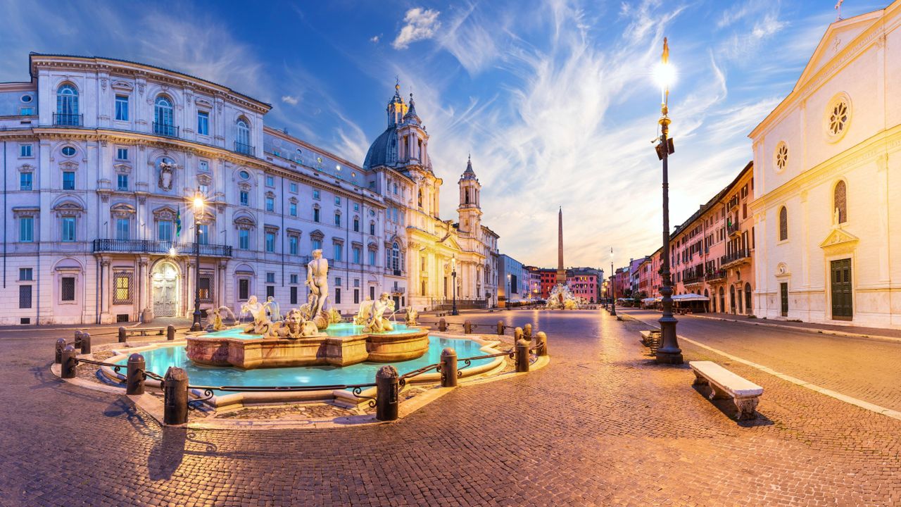 Piazza Navona with the Moor Fountain and Basilica at sunset, Rome, Italy