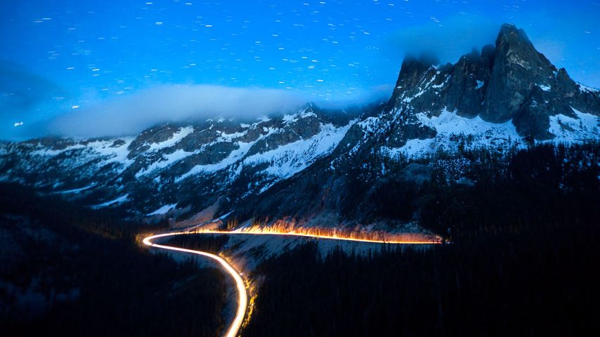 Headlights on State Route 20, the North Cascades Scenic Highway, Washington