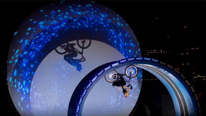 Danny MacAskill completes a full five metre loop-the-loop on a bicycle in front of the London Eye