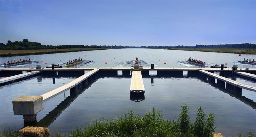 Boats leaving their stations at the start of a race at Eton Dorney, the venue for rowing and canoe sprint events during the 2012 Summer Games in London, England