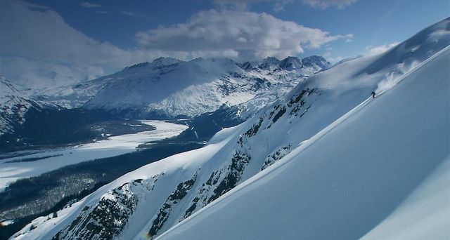 Skier making turns on a ridge near Valdez, Alaska