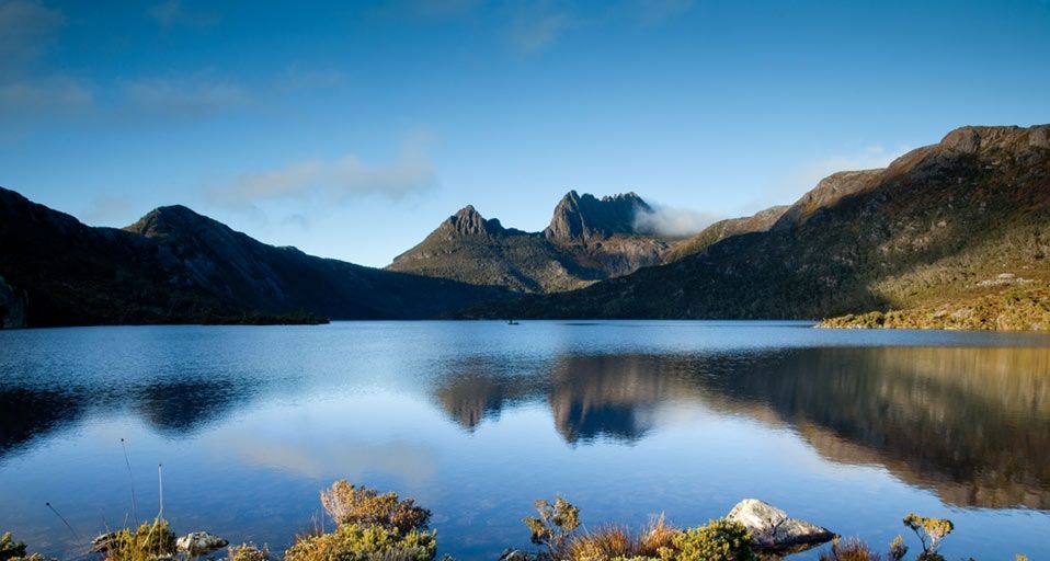 Dawn reflections on calm fresh water lake. Dove Lake, Cradle Mountians, Tasmania, Australia.