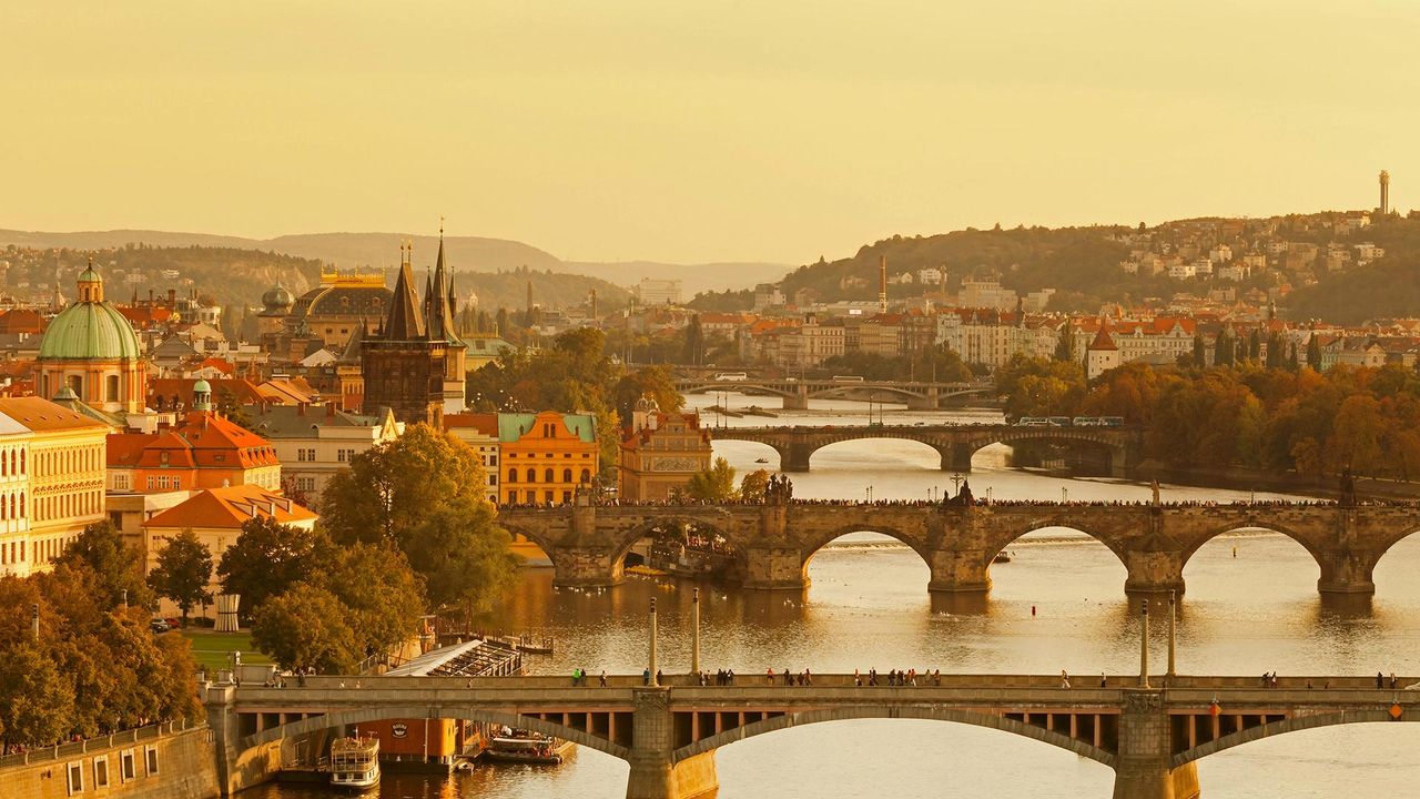 For the 30th anniversary of Czechoslovakia's Velvet Revolution, bridges over the Vltava River, including the Charles Bridge and Old Town Bridge Tower, Prague, Czech Republic