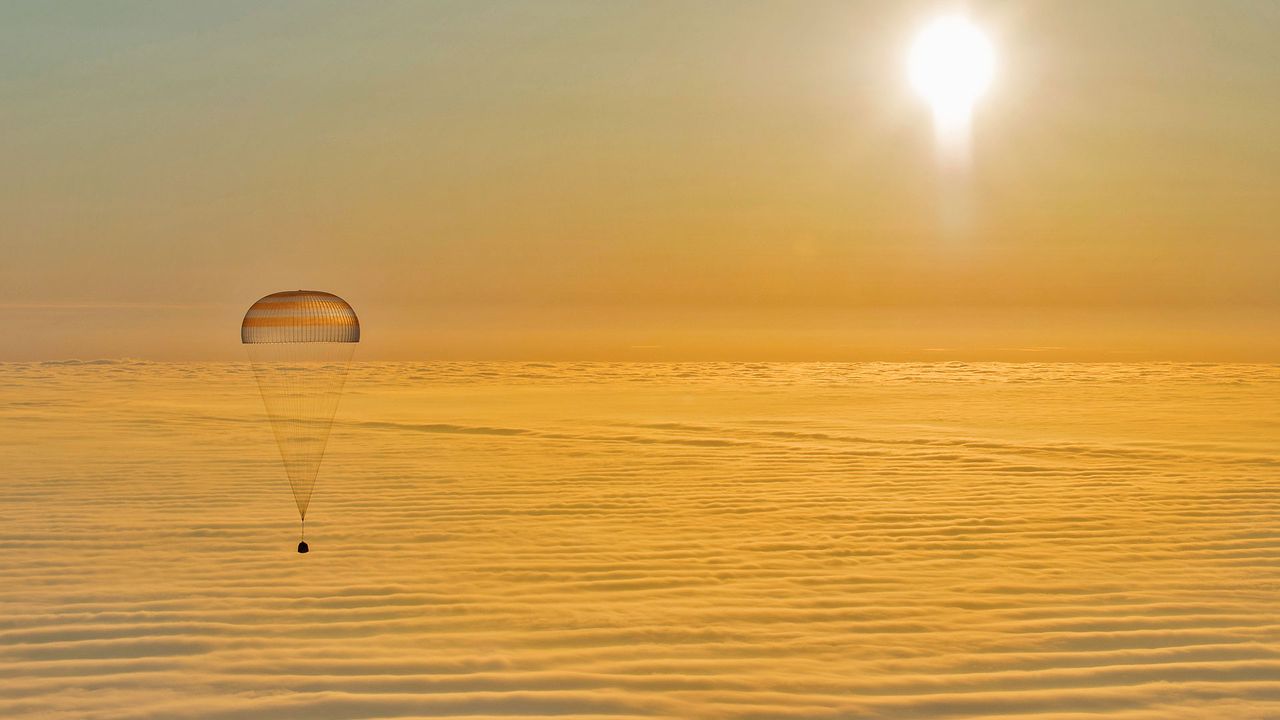 A Soyuz descent module returns to Earth 