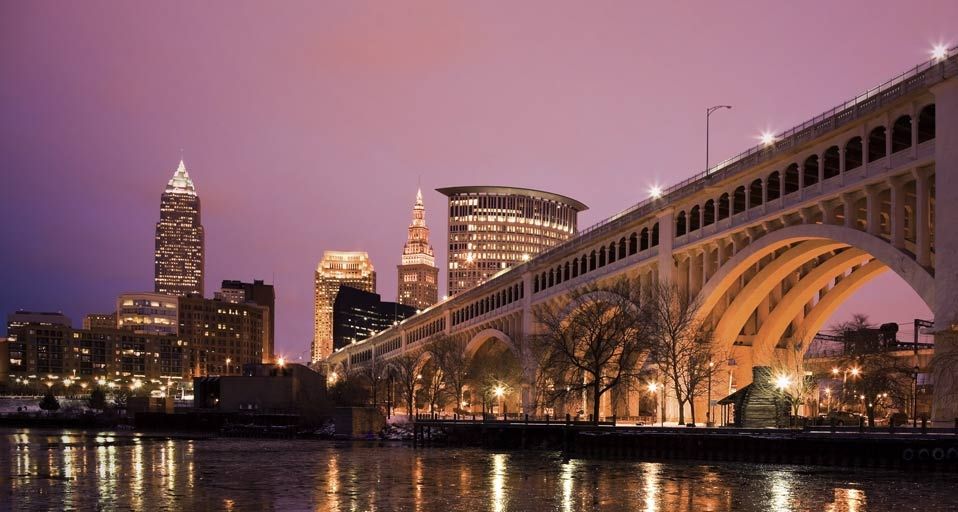 Bridge crossing Cuyahoga River at dusk in Cleveland, Ohio