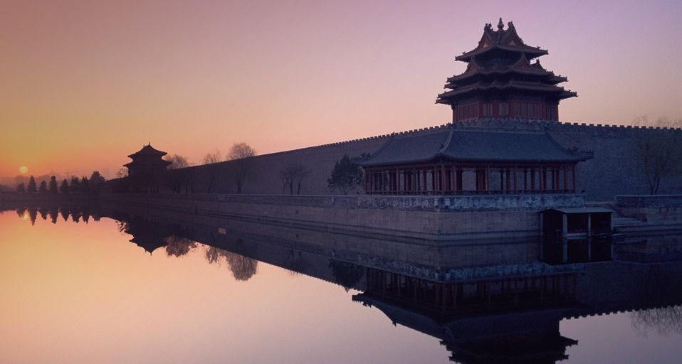 Sunrise over the walls of the Forbidden City, Beijing, China