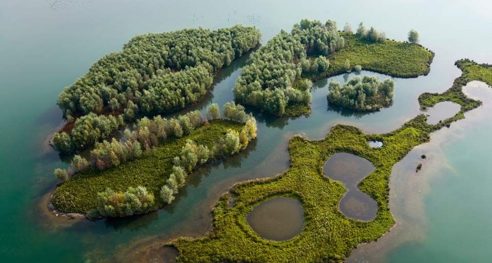 Aerial view of islands in a sand quarry, Jumieges, Seine Valley, France