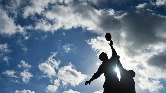 Bronze statue of a rugby line-out by British sculptor Gerald Laing outside Twickenham Stadium, south-west London