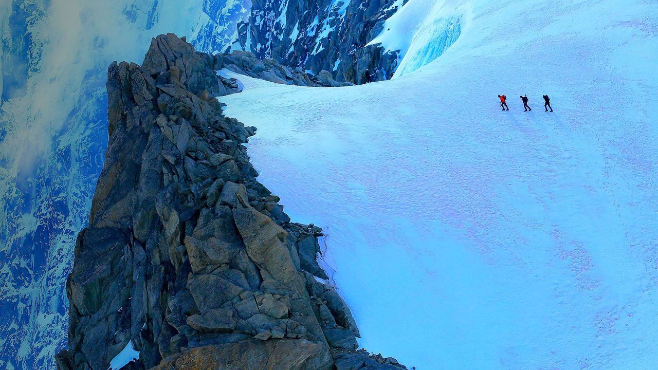 Hikers on alpine glacier, Mont Blanc, Chamonix, France