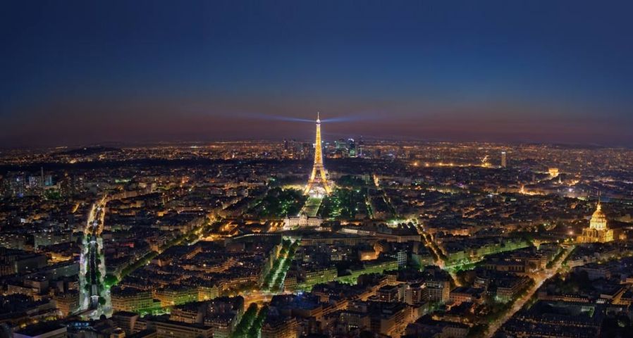 Night falls on Paris,  the famously well-lit city, in this mosaic composed of 22 images
