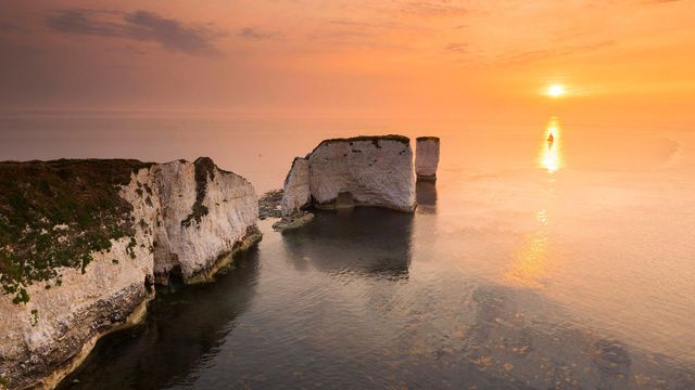 Sunrise at the chalk pinnacles of Old Harry Rocks, near Studland, Dorset