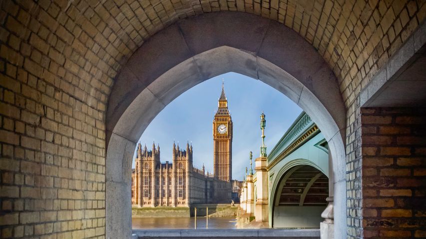View of Big Ben and the Palace of Westminster through a pedestrian tunnel, London, England 